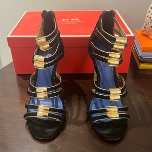 Coach heels, black suede with gold detail and zippers in the back